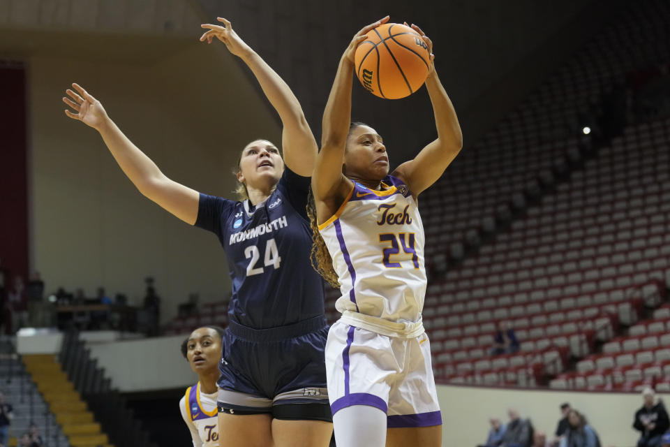 Tennessee Tech guard Jada Guinn, right, pulls down the ball in front of Monmouth center Belle Kranbuhl during the first half of a First Four college basketball game in the NCAA women's Basketball Tournament in Bloomington, Ind., Thursday, March 16, 2023. (AP Photo/AJ Mast)