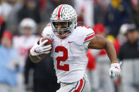 FILE - In this Nov. 30, 2019, file photo, Ohio State running back J.K. Dobbins runs for a 33-yard touchdown against Michigan in the second half of an NCAA college football game, in Ann Arbor, Mich. Dobbins was selected to The Associated Press All-Big Ten Conference team, Wednesday, Dec. 11, 2019. (AP Photo/Paul Sancya, File)