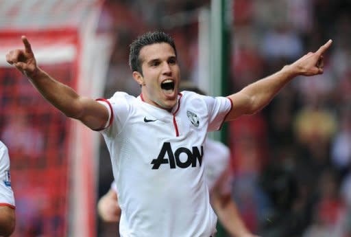 Manchester United's Robin van Persie (C) celebrates scoring his 3rd goal during their English Premier League match vs Southampton at St Mary's in Southampton, on September 2