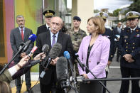 <p>French Interior Minister Gerard Collomb (C) speaks to the press next to French Defence Minister Florence Parly (R) after meeting with soldiers wounded in an attack this morning in Levallois-Perret at the Begin Military Teaching Hospital in Saint-Mande, outside Paris, on August 9, 2017. Photo: Stephane de Sakutin/AFP/Getty Images) </p>