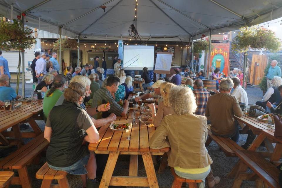 Rand Jack, one of the founders, of the Whatcom Land Trust gave a presentation about the Governors Point land donation during a public deed signing ceremony at Boundary Bay Brewery on Wednesday, Sept. 13, in Bellingham, Wash.