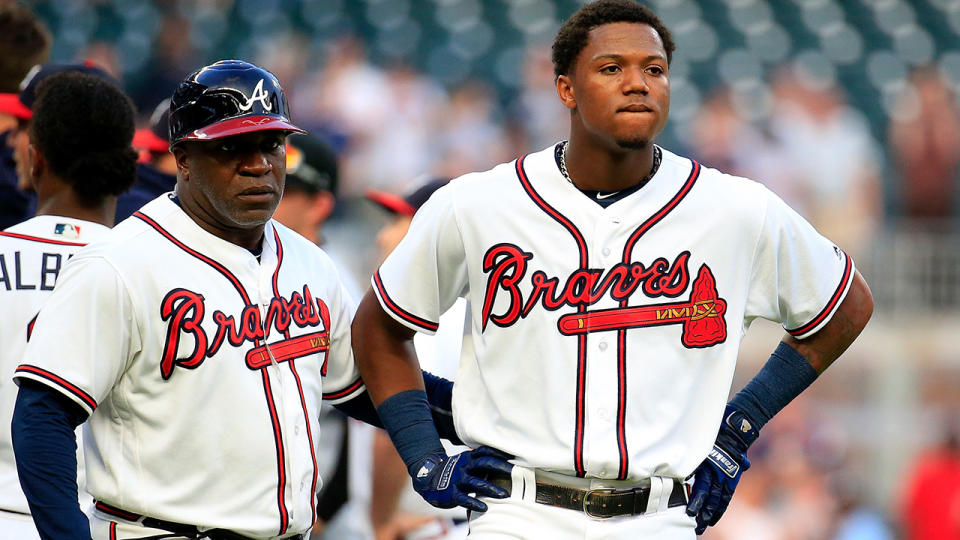 Ronald Acuna Jr. #13 (R) of the Atlanta Braves reacts to being hit by the first pitch of the game against the Miami Marlins at SunTrust Park on August 15, 2018 in Atlanta, Georgia. (Photo by Daniel Shirey/Getty Images)