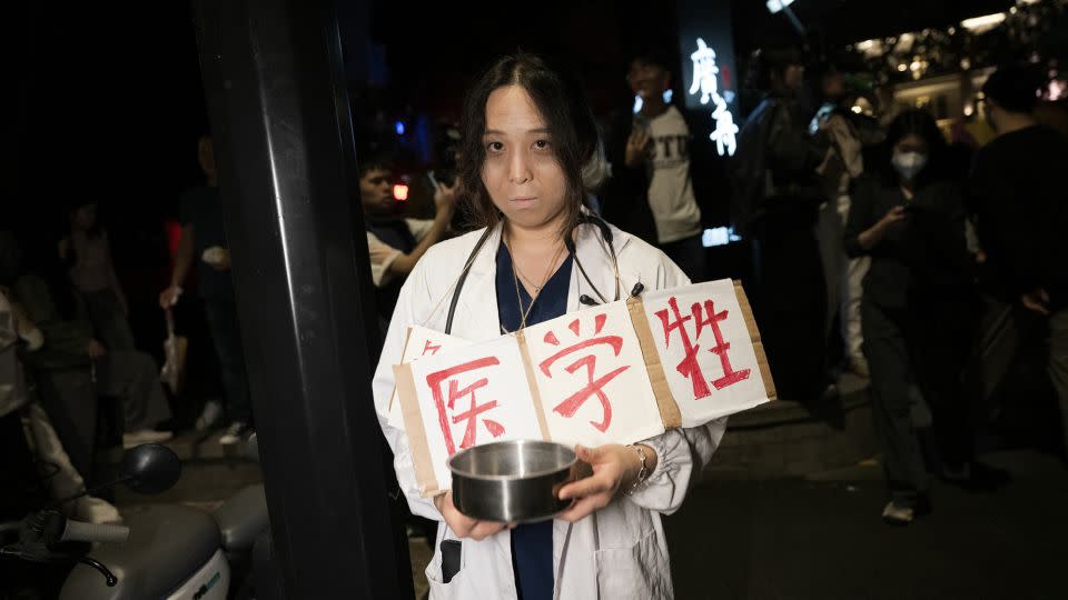 A woman dressed up as a starving medical student. - Zhou You/VCG/Getty Images