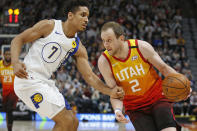 Indiana Pacers guard Malcolm Brogdon (7) guards Utah Jazz forward Joe Ingles (2) in the second half of an NBA basketball game Monday, Jan. 20, 2020, in Salt Lake City. (AP Photo/Rick Bowmer)