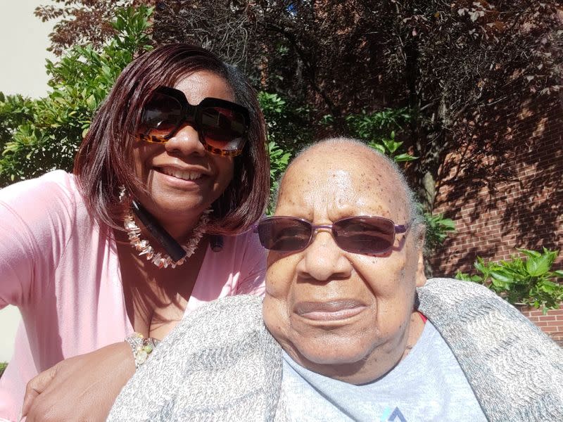 Garnice Robertson poses with her mother Georgia Mae Clardy at a nursing facility in Kansas City