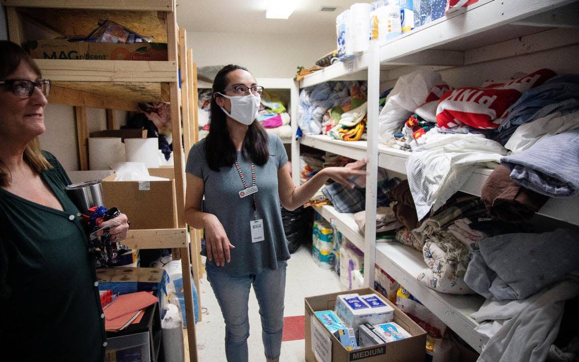 Nancy Tuttle, housing specialist, shows the blankets and bedding available for families and clients of the Salvation Army in Nampa.