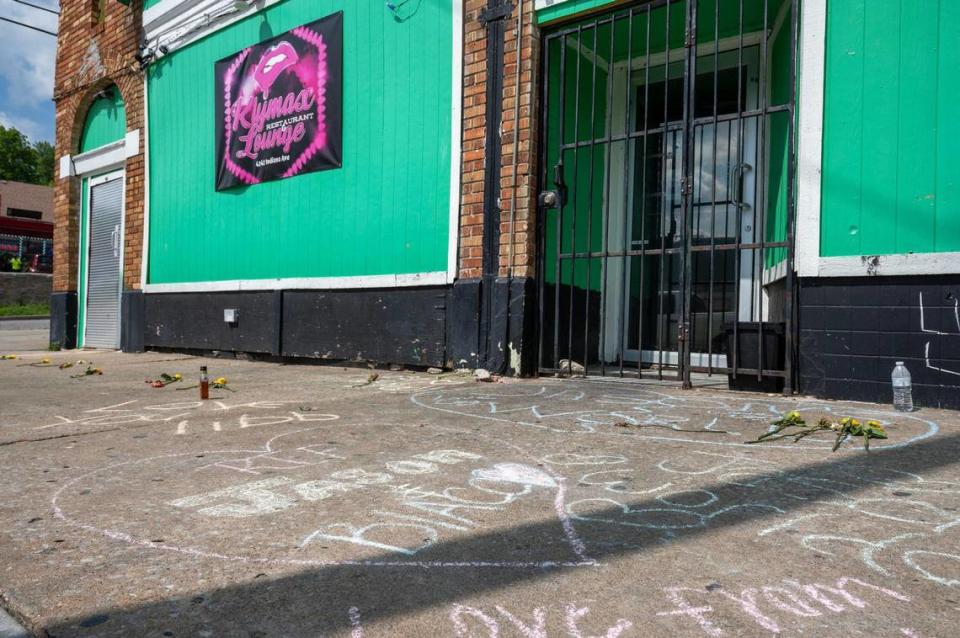 Messages written in chalk are seen on the sidewalk outside Klymax Lounge on Monday, May 22 in Kansas City. Three people were killed and two were injured in a shooting Sunday at the nightclub.