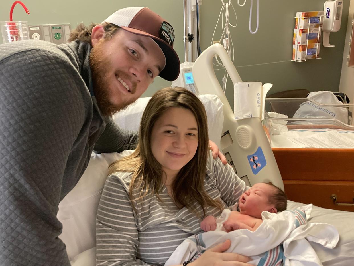 Emily and Josiah Simon with their newborn baby, Amara.