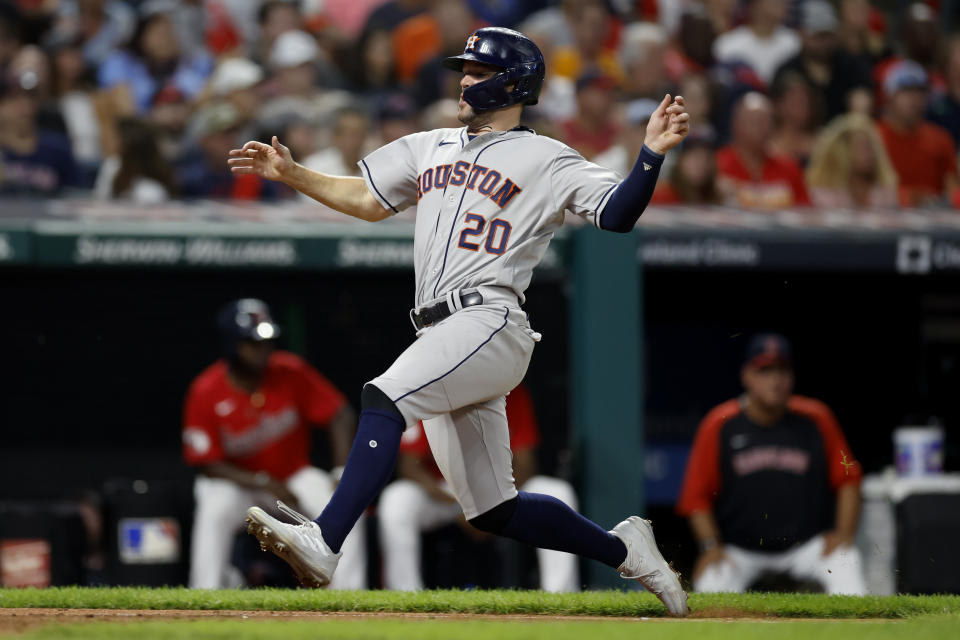 Houston Astros' Chas McCormick scores on a double by Martin Maldonado during the fifth inning of the team's baseball game against the Cleveland Guardians, Thursday, Aug. 4, 2022, in Cleveland. (AP Photo/Ron Schwane)