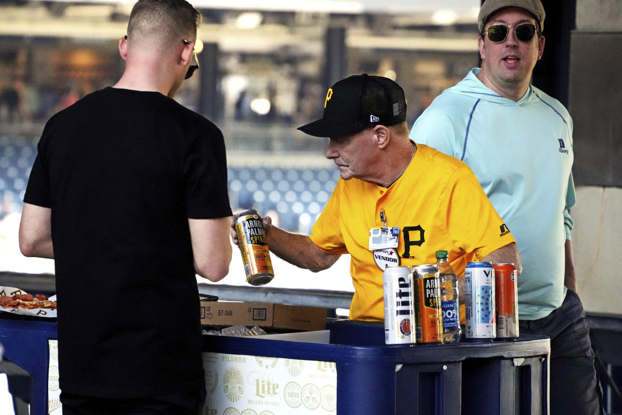 A vendor at PNC Park sells a can of Arnold Palmers Spike Tea before a baseball game between the Pittsburgh Pirates and the Houston Astros in Pittsburgh, Wednesday, April 12, 2023. (AP Photo/Gene J. Puskar)