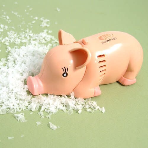 This <a href="https://amzn.to/2EeAFg9" target="_blank" rel="noopener noreferrer">mini vacuum﻿</a> shaped like a pig is adorable and useful. It works for countertops or desktops, so this is a safe gift for almost any White Elephant party.