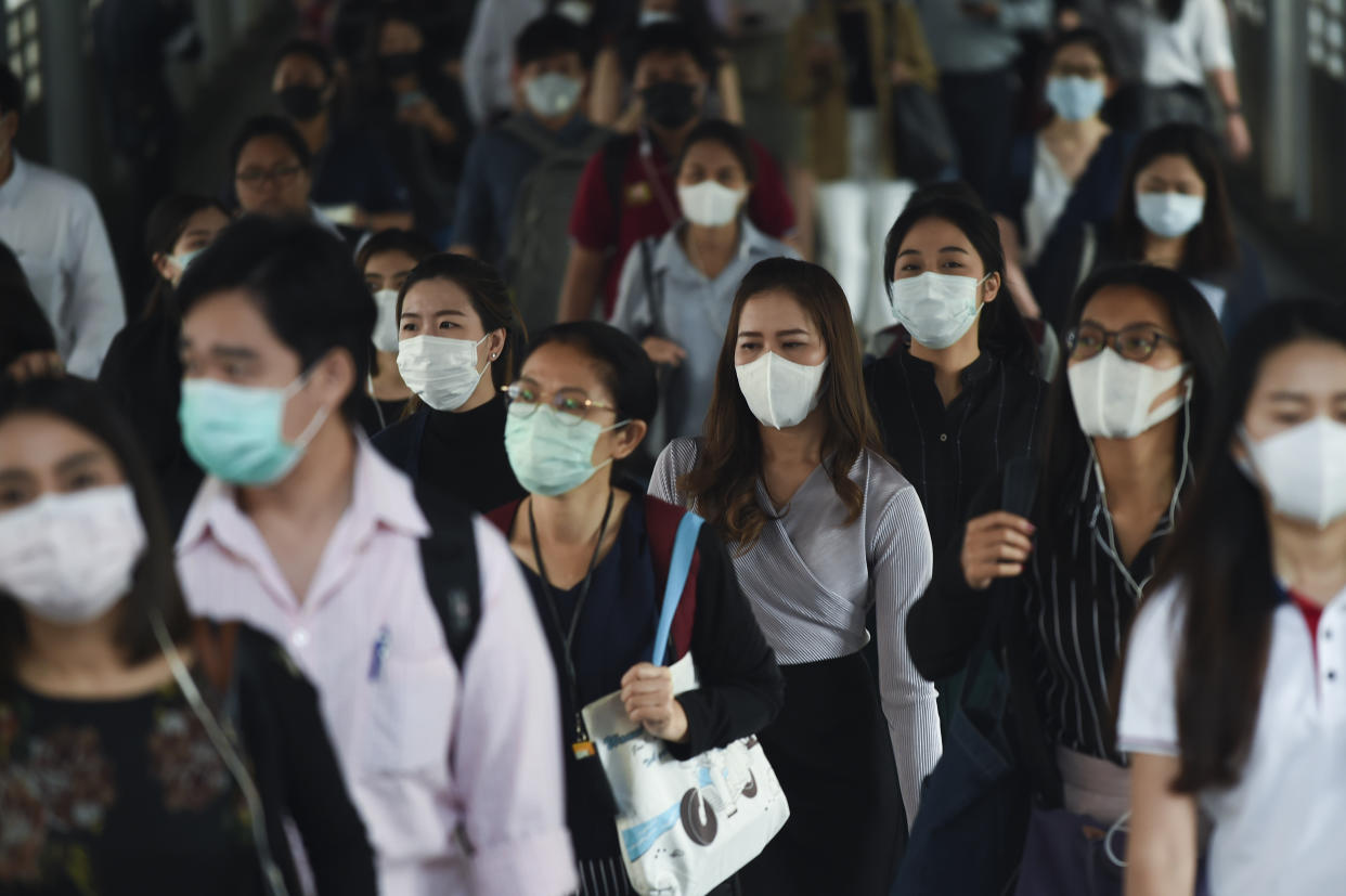 People wear protective masks at a BTS Sky train station in Bangkok, Thailand, 28 January, 2020Thai health officials are stepping up monitoring and inspection for the new SARS-like coronavirus after the Public Health Ministry confirmed fourteen cases in the country. The virus has so far killed at least 106 people and infected around 4,599 others, mostly in China.  (Photo by Anusak Laowilas/NurPhoto via Getty Images)