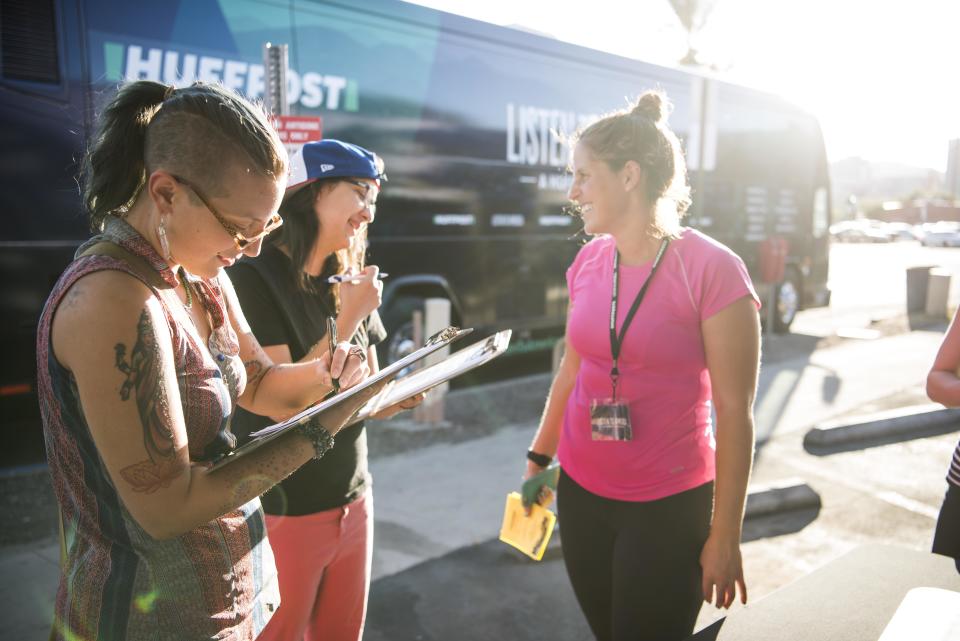 Rachel Elman&nbsp;helps&nbsp;Alora Cohen and Cristina Siqueires to sign up to be interviewed.