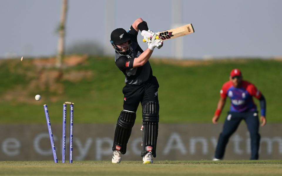Tim Seifert of New Zealand is bowled by Mark Wood of England during the England and New Zealand warm Up Match prior to the ICC Men's T20 World Cup at on October 20, 2021 in Abu Dhabi, United Arab Emirate -  Gareth Copley-ICC/ICC via Getty Images