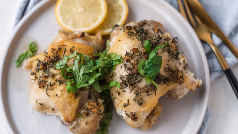 Italian chicken thighs on plate 