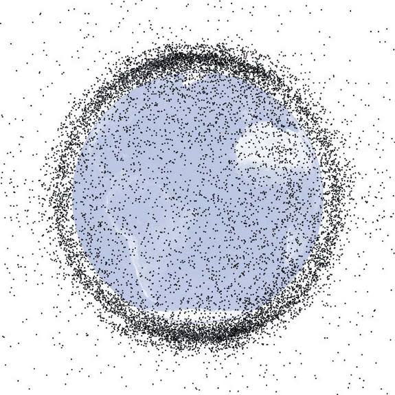 Each dot represents a bit of known space junk that's at least 4 inches (10 cm) in low-Earth orbit, where the space station and shuttles roam. In total, some 19,000 manmade objects this size or bigger orbit Earth as of July 2009; most are in low