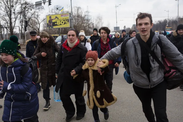 People just evacuated from Irpin rush through the checkpoint on March 6, 2022 in Kyiv, Ukraine.
