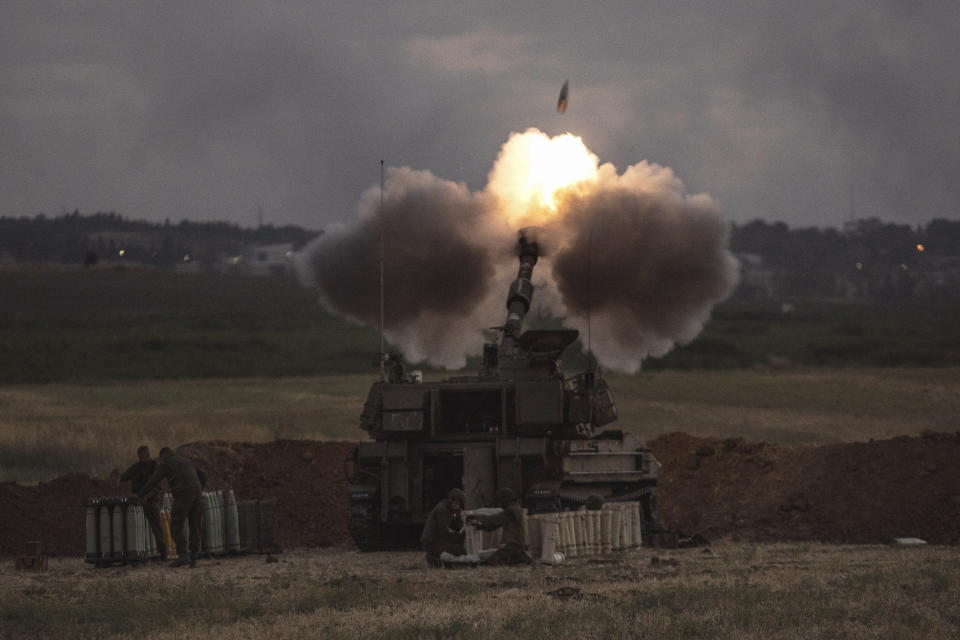 An Israeli artillery unit fires toward targets in the Gaza Strip, at the Israeli Gaza border, Monday, May 17, 2021. (AP Photo/Heidi Levine)