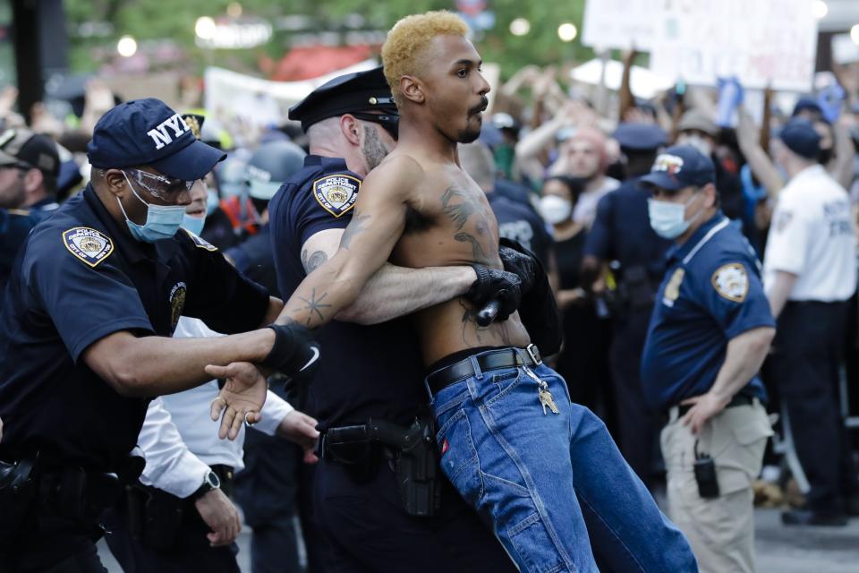 A protester is arrested during a rally at the Barclays Center over the death of George Floyd, a black man who was in police custody in Minneapolis Friday, May 29, 2020, in the Brooklyn borough of New York. Floyd died after being restrained by Minneapolis police officers on Memorial Day. (AP Photo/Frank Franklin II)