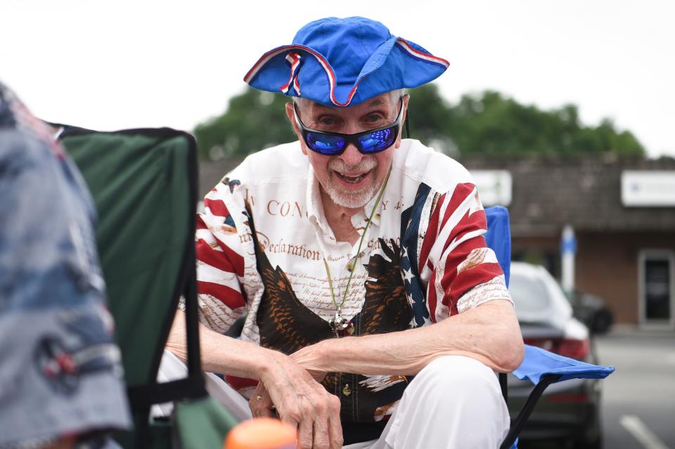 Paul Garrison is decked out in his red, white and blue attire to watch the Farragut Independence Day Parade on Kingston Pike, Tuesday, July 4, 2023.