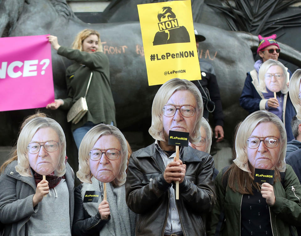 <p>Members of the global citizen movement AVAAZ wear masks depicting the face of former National Front party leader Jean-Marie Le Pen with the hair of his daughter and French far-right presidential candidate, Marine Le Pen, as they stage a protest as part of a May Day rally in Paris, France, Monday, May 1st, 2017. With just six days until a French presidential vote that could define Europe’s future, far-right leader Marine Le Pen and centrist Emmanuel Macron are holding high-stakes rallies Monday. (AP Photo/Thibault Camus) </p>