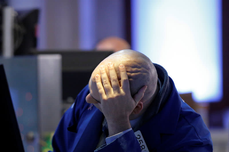 A Trader works at his post on the floor of the New York Stock Exchange (NYSE) in New York City, U.S., December 2, 2016. REUTERS/Brendan McDermid