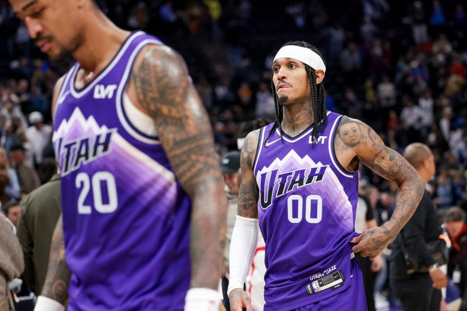 Utah Jazz forward John Collins (20) and guard Jordan Clarkson (00) come off the court after losing to the LA Clippers at the Delta Center in Salt Lake City on Friday, Dec. 8, 2023.