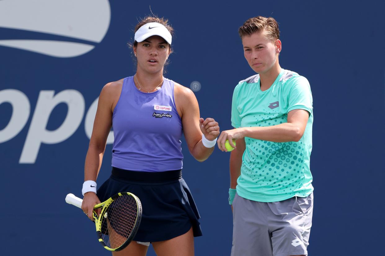 Desirae Krawczyk of the United States (left) and Demi Schuurs of Netherlands react to a point against Marta Kostyuk of Ukraine and Shuai Zhang of China during their women's doubles match at the U.S. Open on Monday.