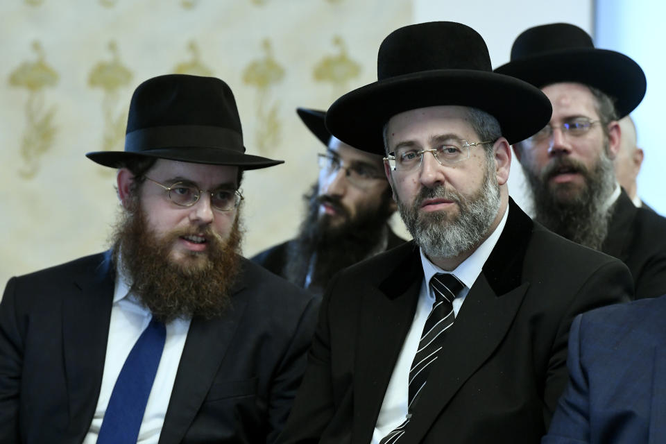 Ashkenazi Chief Rabbi of Israel David Lau, right, and Chief Rabbi of the Unified Israelite Congregation of Hungary (EMIH) Slomo Koves, left, attend the signing ceremony of a comprehensive agreement between Deputy prime minister in charge of Hungarian communities abroad, church policy and national and ethnic minorities, Zsolt Semjen and EMIH at the Castle District premises of the Prime Minister's Office, in Budapest, Hungary, Monday, Nov. 18, 2019. By signing the agreement, the Hungarian state acknowledges the historical traditions of the Jewish community and "EMIH's service to the renaissance of Hungary's Jewish community", Semjen said at the signing ceremony.