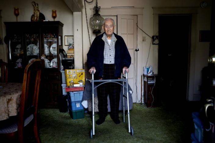 LOS ANGELES, CA - FEBRUARY 17: Paul Hult, 102, is a WWII veteran and retired Southern Pacific railroad switch man. He's on a tight budget and spends most of his income on 24-7 home health aids, shown at his apartment on Friday, Feb. 17, 2023 in Los Angeles, CA. Hult's $500 plus gas bill has hit him hard, he says he may have to give up his caretakers. Paul has lived at the Rose Garden Court apartments since 1951. He was born Januaray 8th,1921 and married to his wife Zora Hult, from 1948 to 2005. Zora was from Croatia where he met her after the war while he was still in the service. They were married and he brought her and her three children over to the United States. (Gary Coronado / Los Angeles Times)