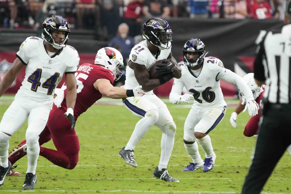 Baltimore Ravens cornerback Brandon Stephens (21) intercepts a pass during the first half of an NFL football game against the Arizona Cardinals Sunday, Oct. 29, 2023, in Glendale, Ariz. (AP Photo/Rick Scuteri)