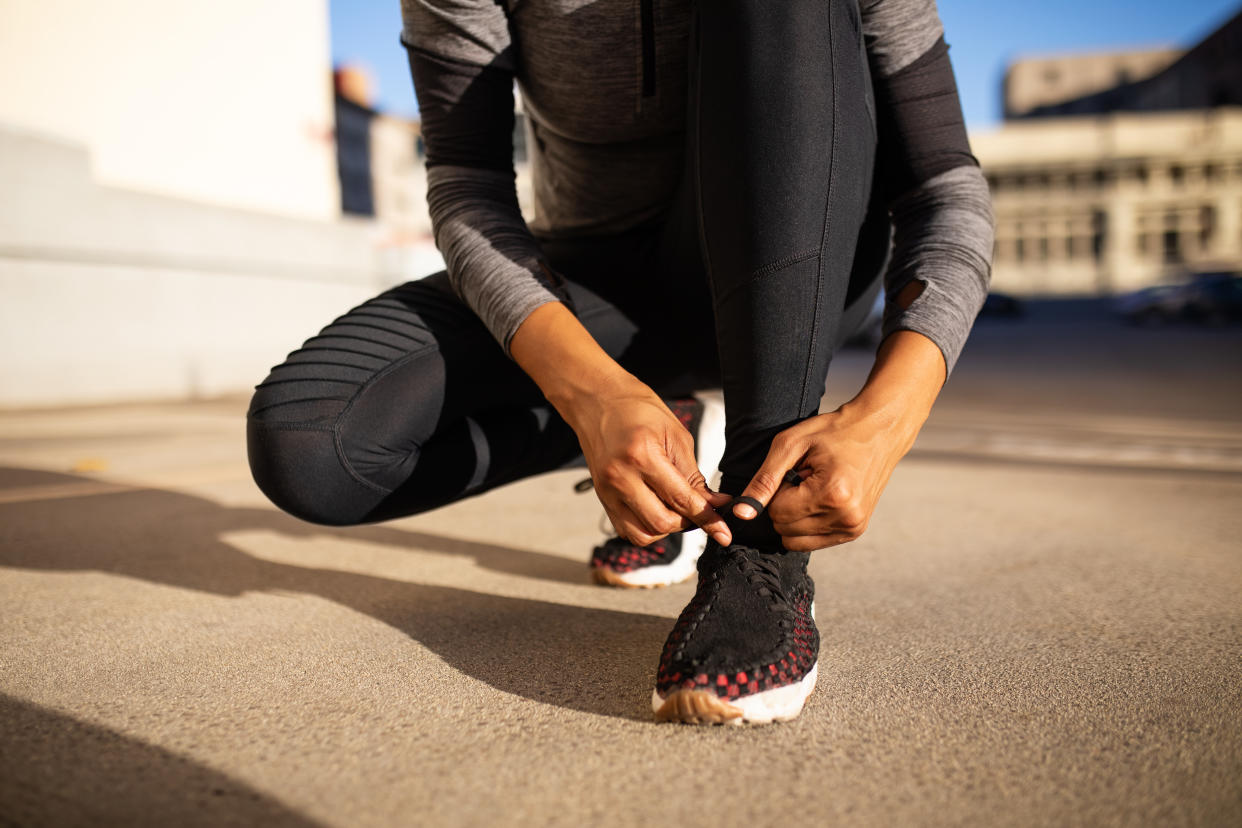 We've gathered 11 of the best women's running shoes that are shopper-approved.  Close up of sporty woman tying shoelace while kneeling outdoors. Woman tying shoelace on running shoes before practice.