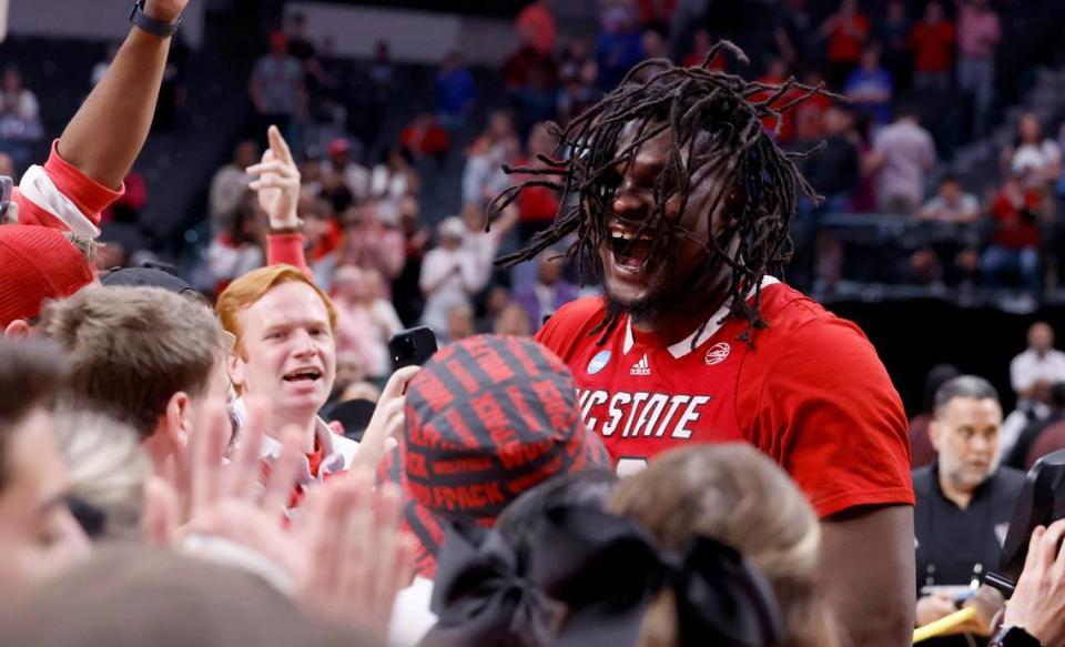 N.C. State’s DJ Burns Jr. celebrates with the band after N.C. State’s 76-64 victory over Duke in their NCAA Tournament Elite Eight matchup at the American Airlines Center in Dallas, Texas, Sunday, March 31, 2024.