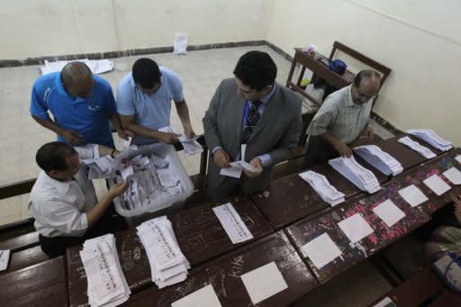 Egyptian election officials count ballots at a polling station in Cairo, May 24. Vote counting was underway in Egypt Friday after two days of polling in a landmark presidential election which pitted stability against the ideals of the uprising that ended Hosni Mubarak's rule