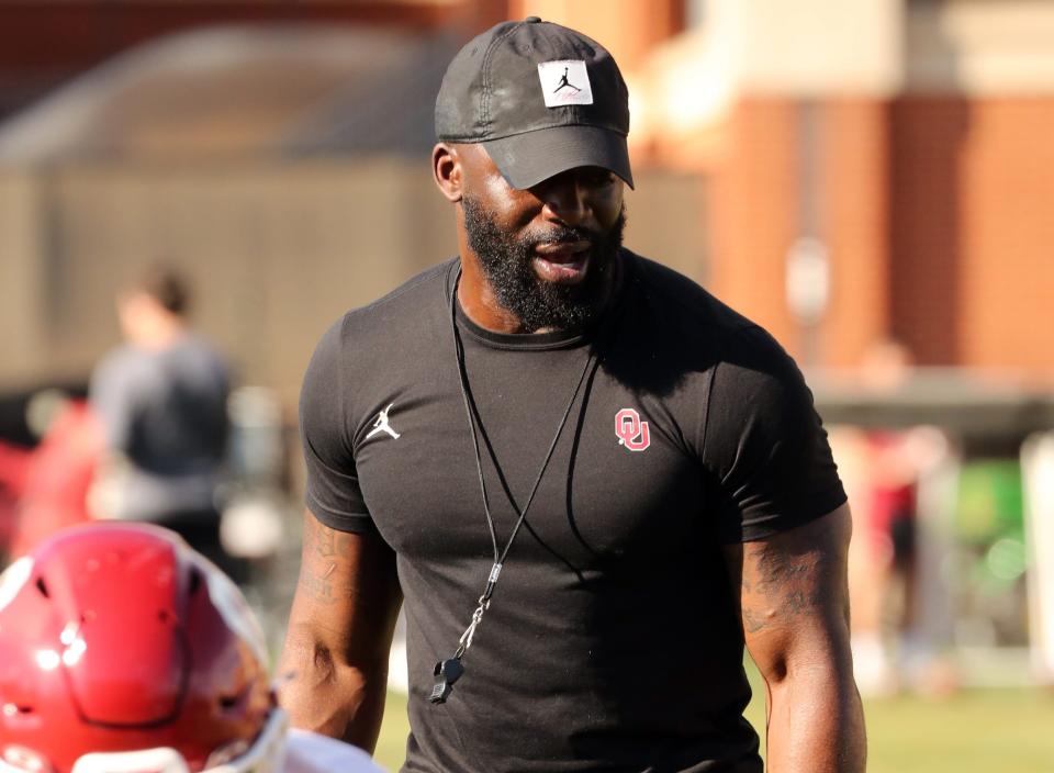 Jay Valai works with players as the University of Oklahoma Sooners (OU) college football team holds spring practice outside of Gaylord Family/Oklahoma Memorial Stadium on March 21, 2023 in Norman, Okla. [Steve Sisney/For The Oklahoman]