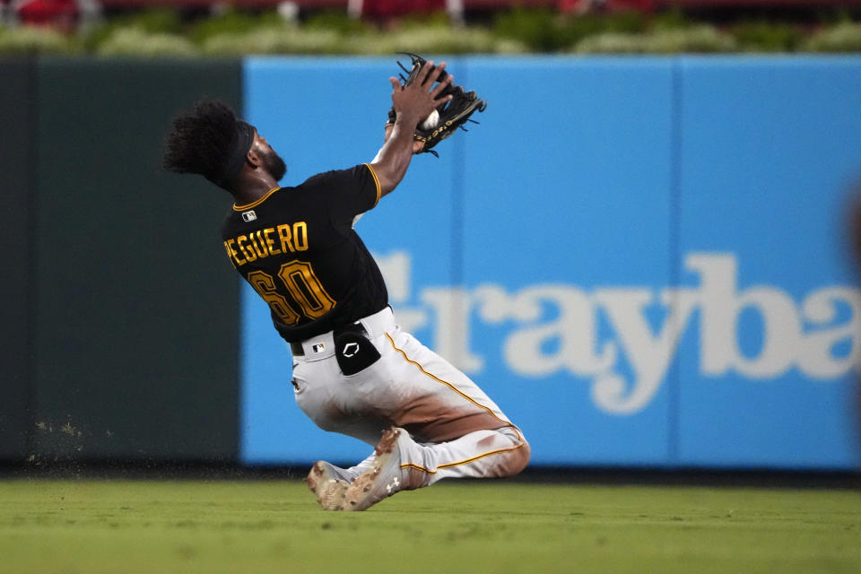 Pittsburgh Pirates shortstop Liover Peguero slides to catch a fly ball by St. Louis Cardinals' Nolan Gorman to end the third inning of a baseball game Friday, Sept. 1, 2023, in St. Louis. (AP Photo/Jeff Roberson)