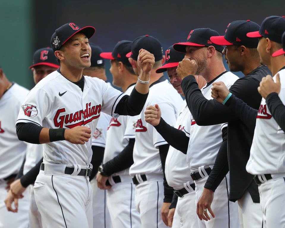 Cleveland Guardians center fielder Steven Kwan (38) fist bumps teammates as he takes the field during pregame announcements before an MLB baseball game against the San Francisco Giants at Progressive Field in Cleveland on Friday.