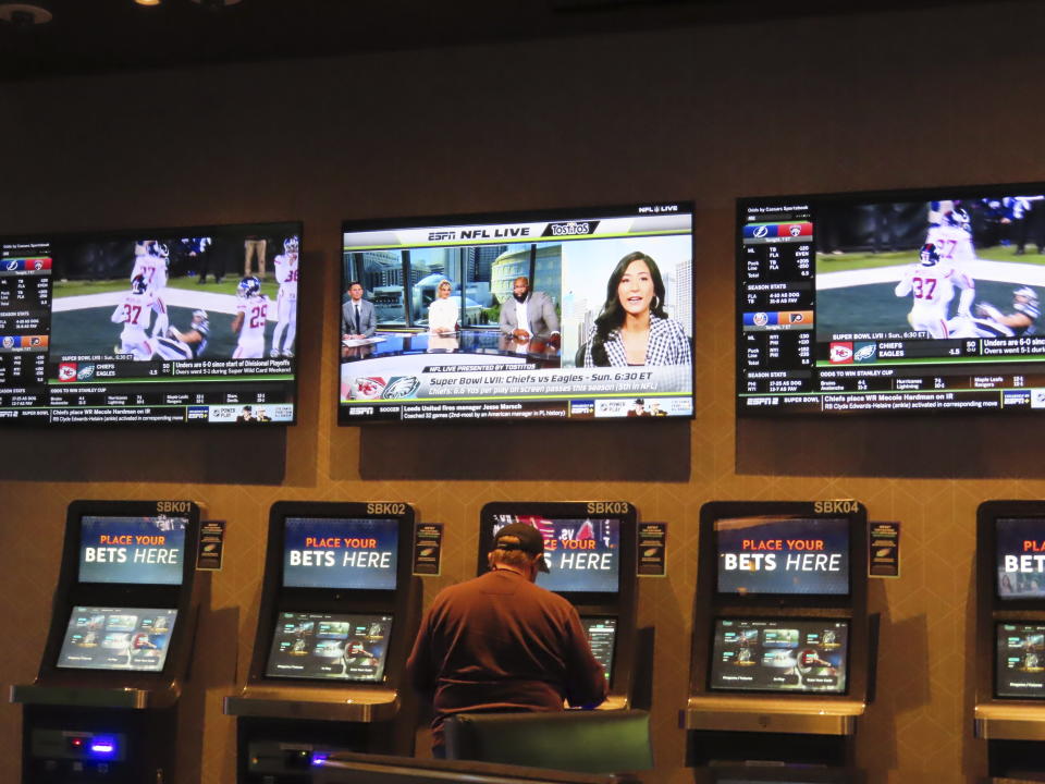 A gambler makes bets at a kiosk in the Ocean Casino Resort in Atlantic City N.J. on Feb. 6, 2023. Americans have bet over $220 billion on sports with legal gambling outlets in the five years since the U.S. Supreme Court cleared the way for all 50 states to offer it. (AP Photo/Wayne Parry)