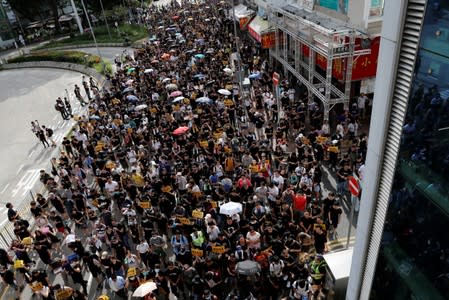 Anti-parallel trading protesters shout slogans during a march at Sheung Shui, a border town in Hong Kong