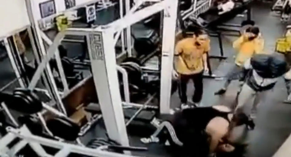 Pictured is the woman after the bar fell on her in the gym