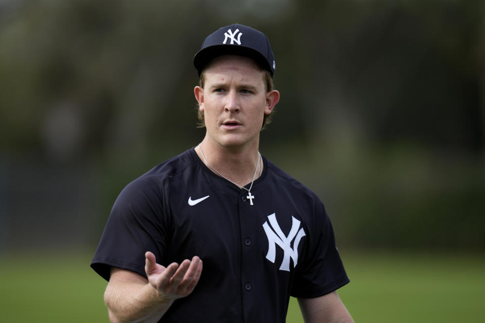 New York Yankees relief pitcher Clayton Beeter walks in the outfield during a baseball spring training workout Thursday, Feb. 15, 2024, in Tampa, Fla. (AP Photo/Charlie Neibergall)