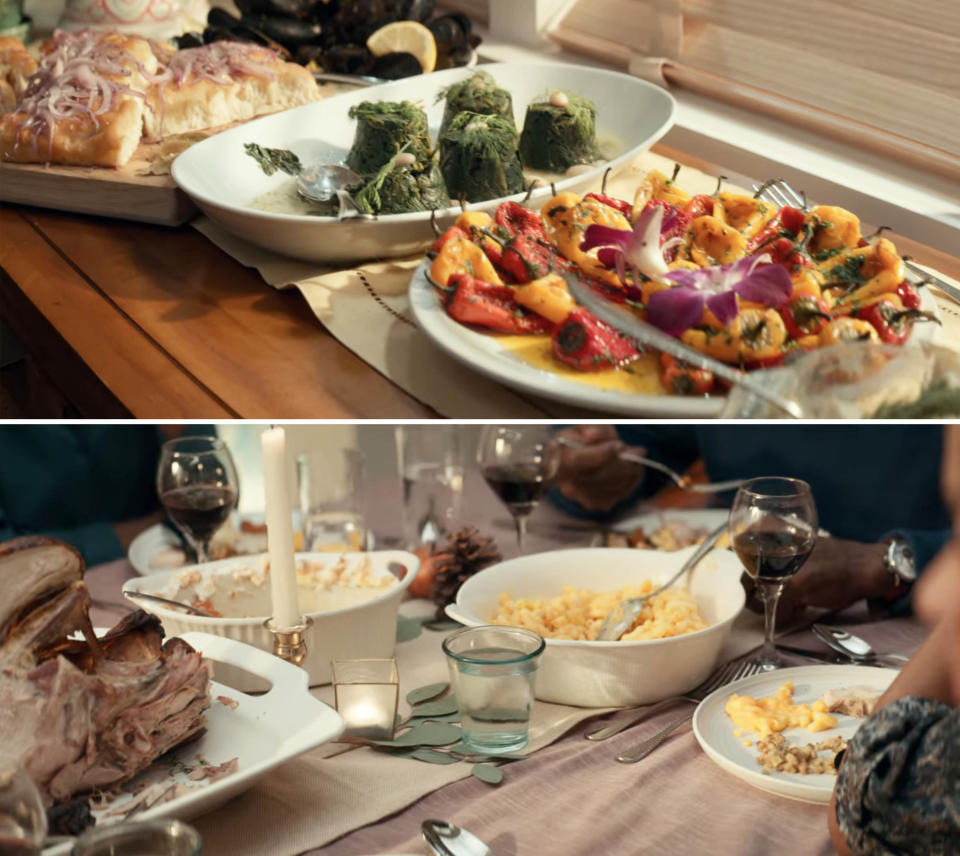 A countertop and a dinner table laden with plates of food