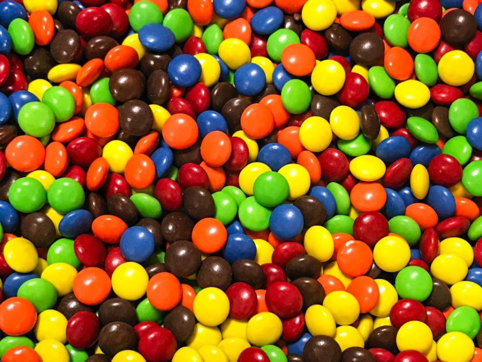 <p>M&Ms were first <a href="https://www.history.com/news/the-wartime-origins-of-the-mm#:~:text=M%26Ms%20were%20first%20released%20in,highlights%20in%20their%20long%20history." rel="nofollow noopener" target="_blank" data-ylk="slk:released in 1941;elm:context_link;itc:0;sec:content-canvas" class="link ">released in 1941</a> and were invented by Mars as a <a href="https://www.history.com/news/the-wartime-origins-of-the-mm#:~:text=M%26Ms%20were%20first%20released%20in,highlights%20in%20their%20long%20history." rel="nofollow noopener" target="_blank" data-ylk="slk:snack for soldiers in World War II;elm:context_link;itc:0;sec:content-canvas" class="link ">snack for soldiers in World War II</a>. The small amount was easy to produce on wartime rations, while the hard candy shell prevented the chocolate from melting in a soldier's bag. </p>