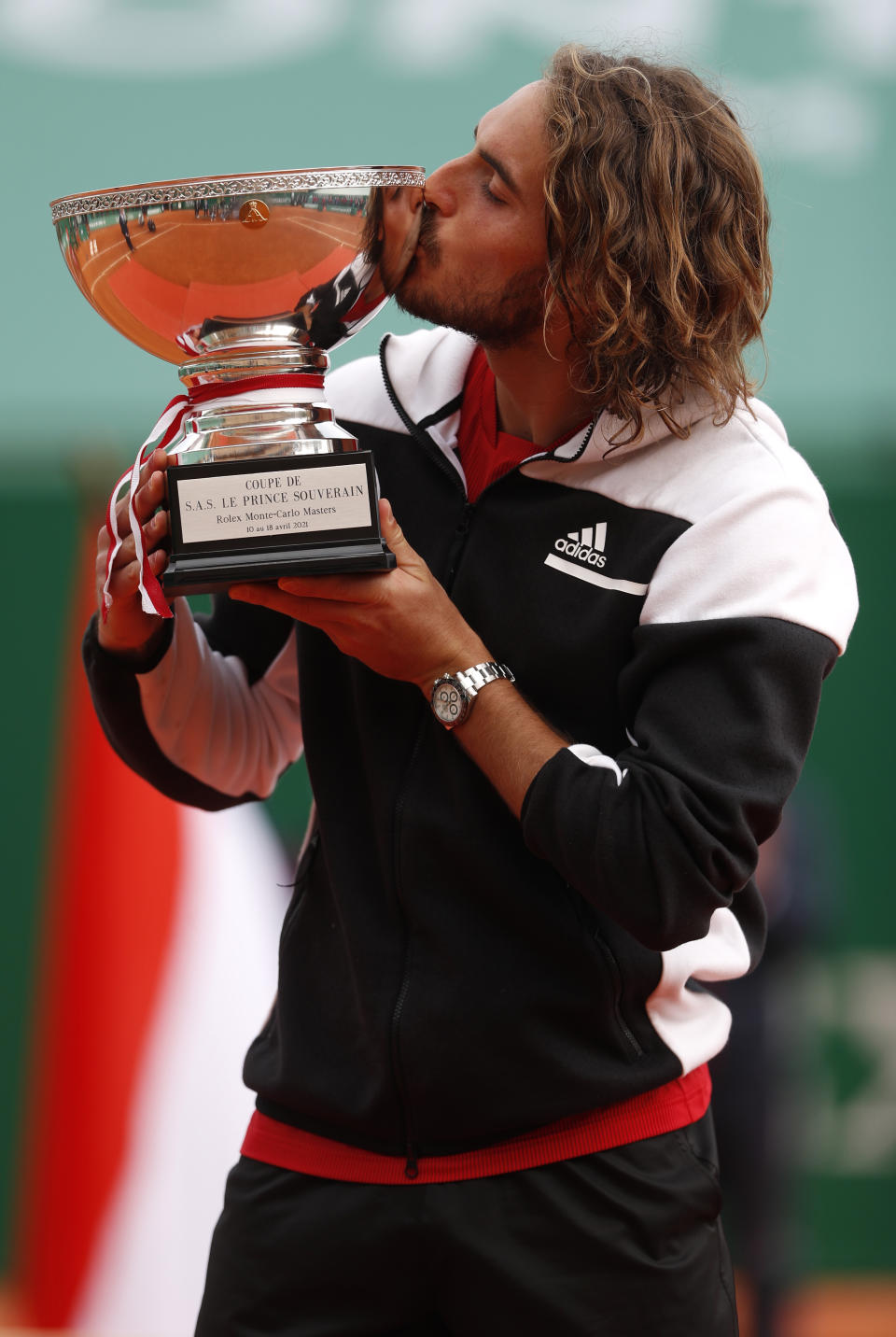 Stefanos Tsitsipas of Greece kisses the trophy after defeating Andrey Rublev of Russia in the Monte Carlo Tennis Masters tournament finals in Monaco, Sunday, April 18, 2021. (AP Photo/Jean-Francois Badias)