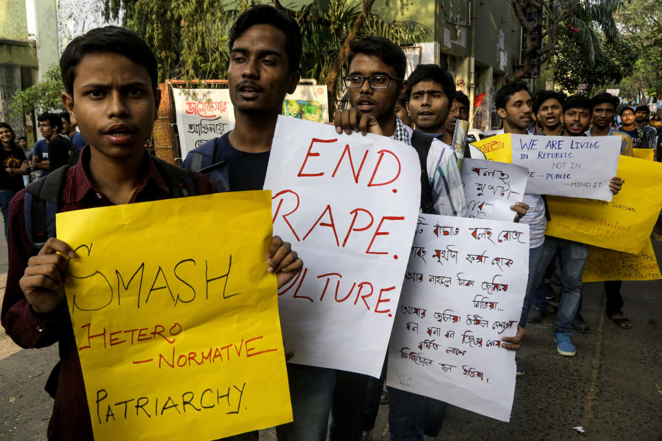 University students hold placards demanding justice in the case of a veterinarian who was gang-raped and killed last week during a protest rally in Kolkata, India, Monday, Dec. 2, 2019. The burned body of the 27-year-old woman was found Thursday morning by a passer-by in an underpass in the southern city of Hyderabad after she went missing the previous night. (AP Photo/Bikas Das)