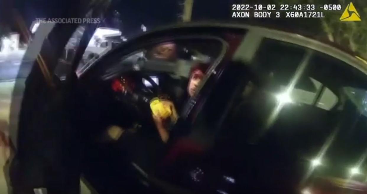 This screenshot from bodycam footage shows a Texas police officer before shooting a teenager who was sitting in his car eating a hamburger.