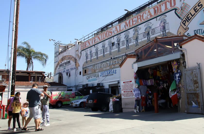 A family shopping at El Mercadito Mariachi in Los Angeles on Thursday, April 6, 2023. (Photo by James Carbone/Los Angeles Times Espanol)