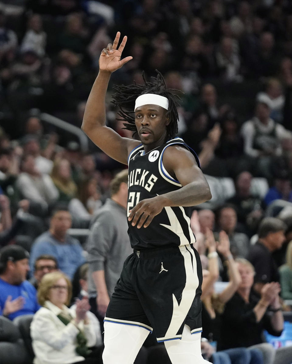 Milwaukee Bucks' Jrue Holiday gestures after making a shot against the Miami Heat during the second half of Game 2 of an NBA basketball first-round playoff series Wednesday, April 19, 2023, in Milwaukee. (AP Photo/Aaron Gash)