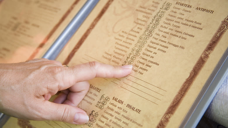 hand pointing at menu