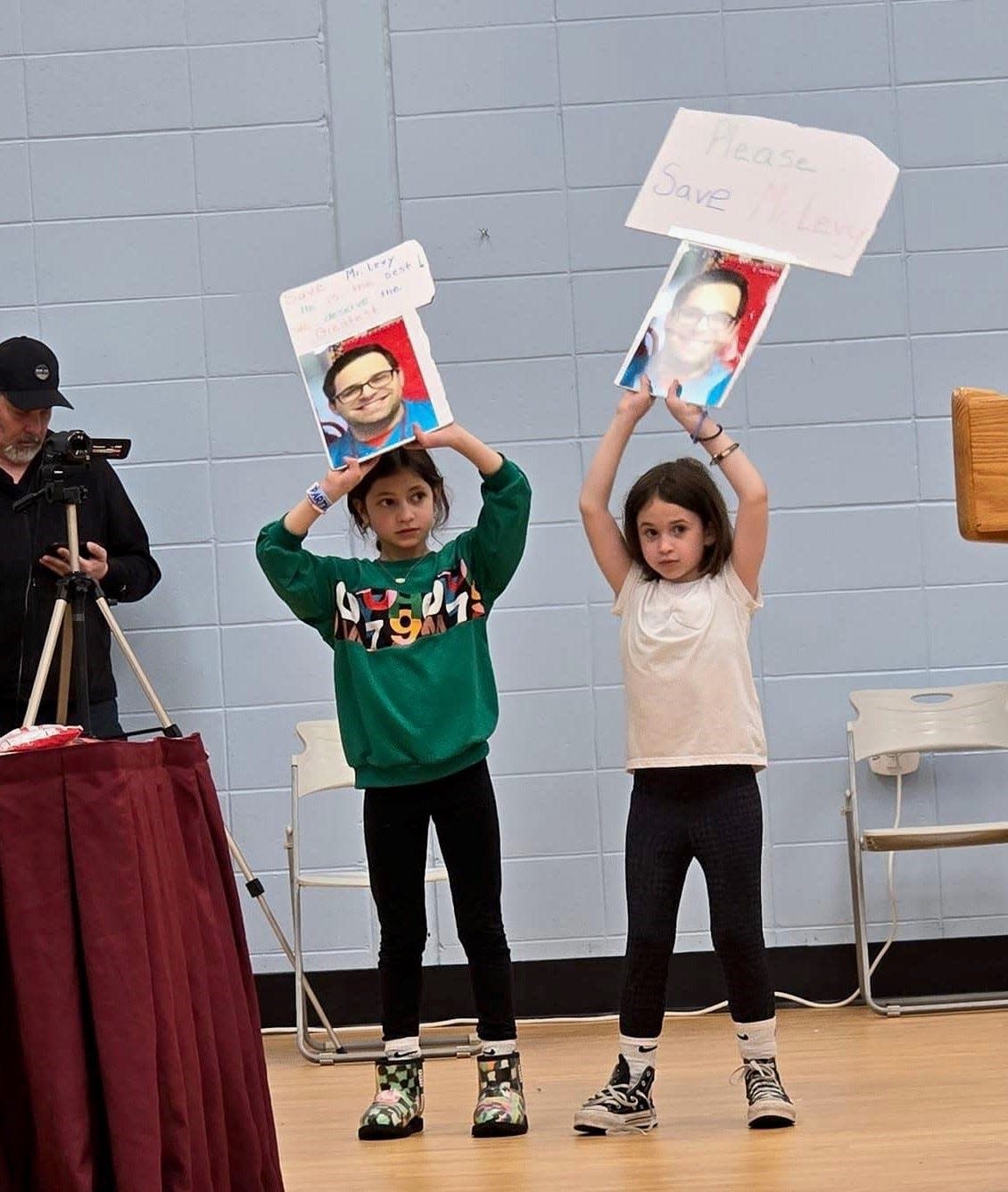 Students from Strathmore Elementary School in Aberdeen hold a signs in support of third-grade teacher Josh Levy at the May 6 Matawan-Aberdeen Board of Education meeting.